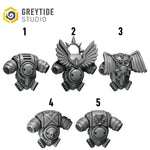 five different views of a futuristic-looking metallic object, possibly a weapon or armor piece, with wings and a skull-like design.