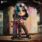 a doll is posed on a pedestal with a sword