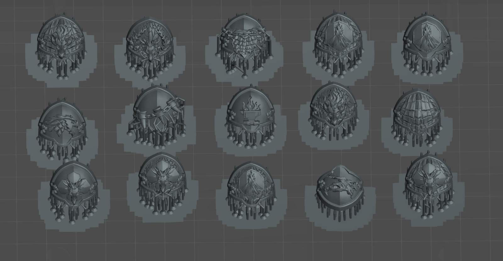 a collection of various 3D models or designs, including shields, helmets, and other metallic or metallic-looking objects. The objects appear to be in a digital format, possibly as a 3D rendering or a 3D model. The image does not contain any text or specific details about the objects, and it does not include any descriptions or explanations about the objects.