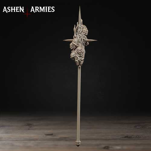 A metal sword-like object with a pointed tip and a decorative design on the front, standing upright on a wooden surface against a dark background.