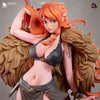 A female character with orange hair and a black bra, wearing a brown skirt, posing with a sword in her hand.