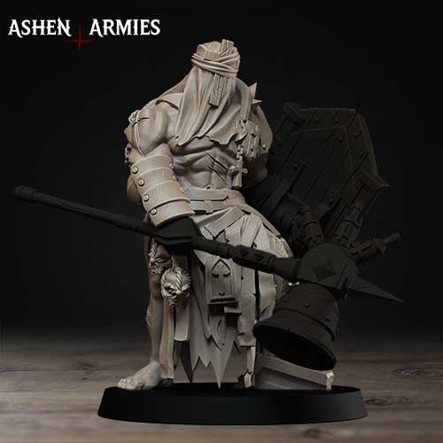 A statue of a warrior figure holding a large weapon, standing on a black base.